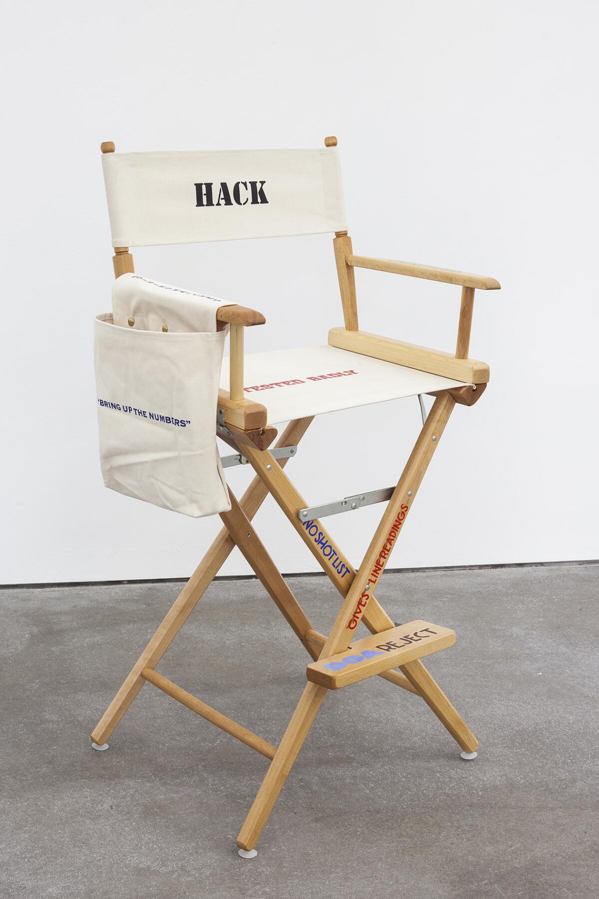 A director's chair with words painted on it
