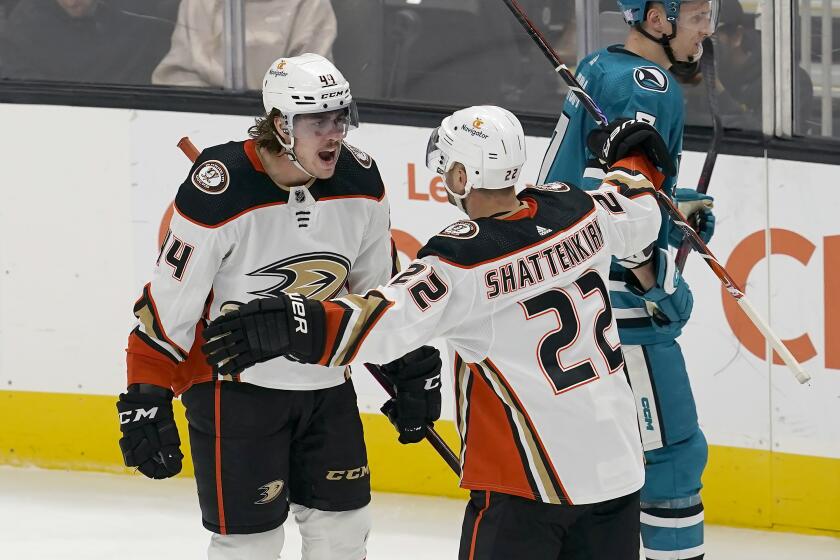 Anaheim Ducks left wing Max Comtois, left, is congratulated by defenseman Kevin Shattenkirk (22) after scoring against the San Jose Sharks during the third period of an NHL hockey game in San Jose, Calif., Tuesday, Nov. 1, 2022. (AP Photo/Jeff Chiu)