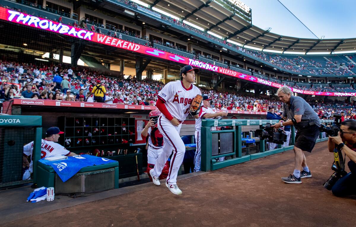 Shohei Ohtani heads to the pitcher's mound during a game between the Angels and Pittsburgh Pirates at Angel Stadium.