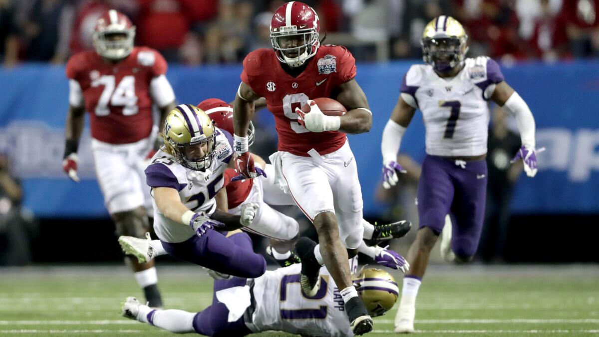 Alabama running back Bo Scarbrough breaks into the Washington secondary for a big gain during the Peach Bowl on Dec. 31.
