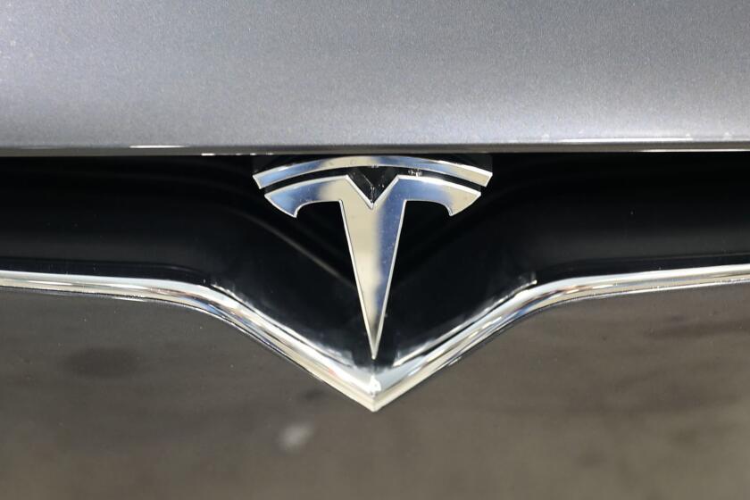 MIAMI, FLORIDA - APRIL 04: The Tesla emblem is seen on a vehicle on April 04, 2019 in Miami, Florida. Tesla announced a first quarter 31% drop in vehicles that were delivered to customers compared to the prior quarter. The news caused the stock to drop approximately 8%. (Photo by Joe Raedle/Getty Images) ** OUTS - ELSENT, FPG, CM - OUTS * NM, PH, VA if sourced by CT, LA or MoD **