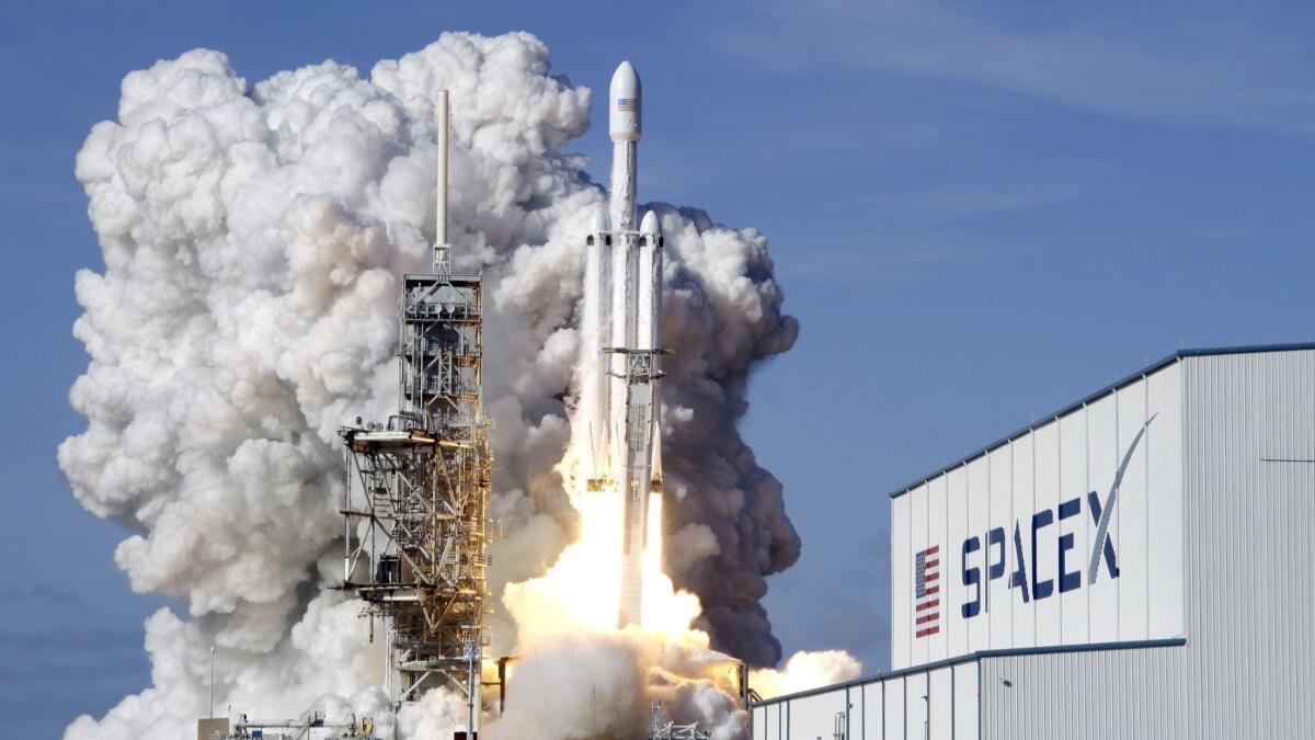A SpaceX Falcon Heavy rocket lifts off from Kennedy Space Center in Cape Canaveral, Fla., in February.