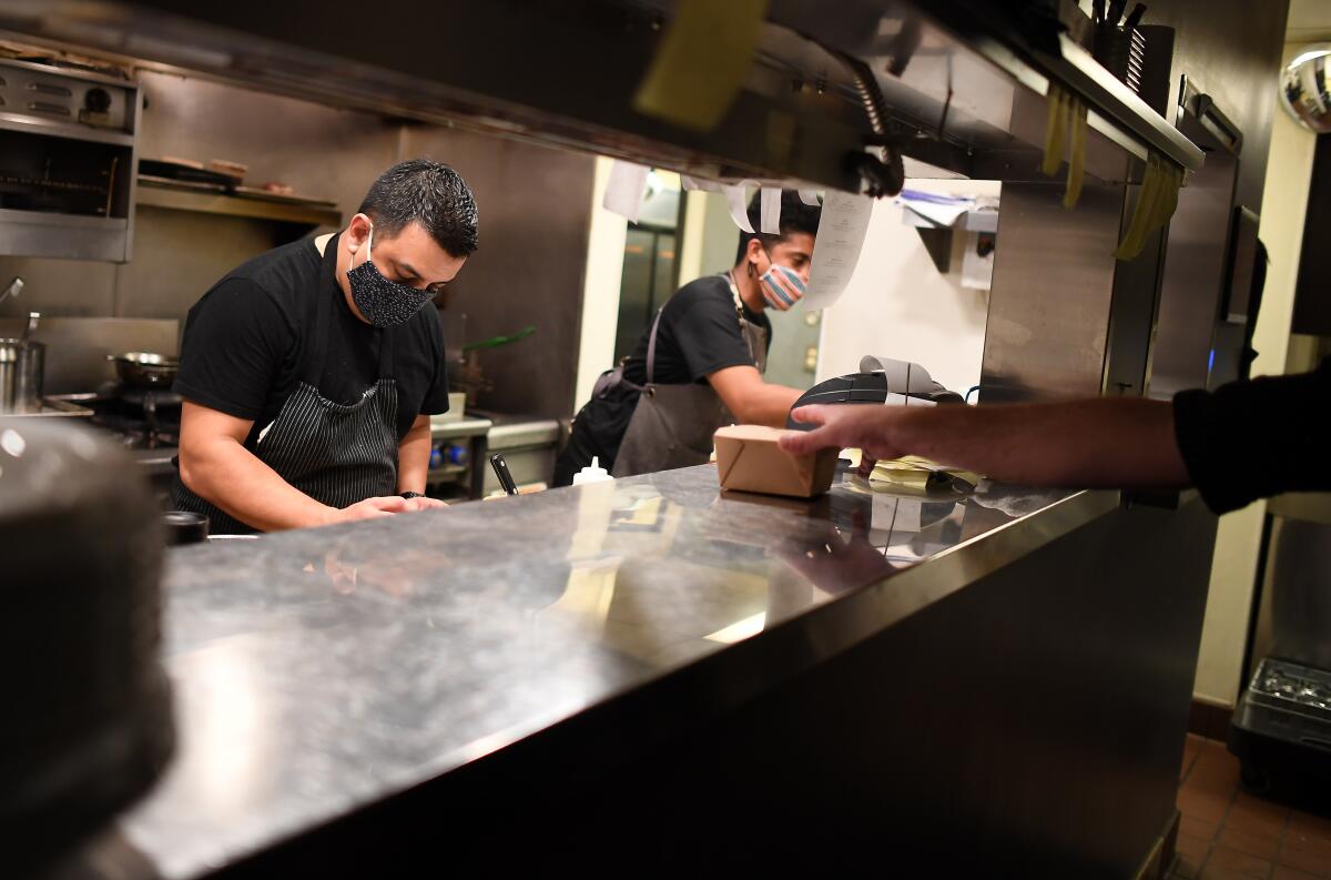 Chefs at work in the kitchen of Michael's in Naples.