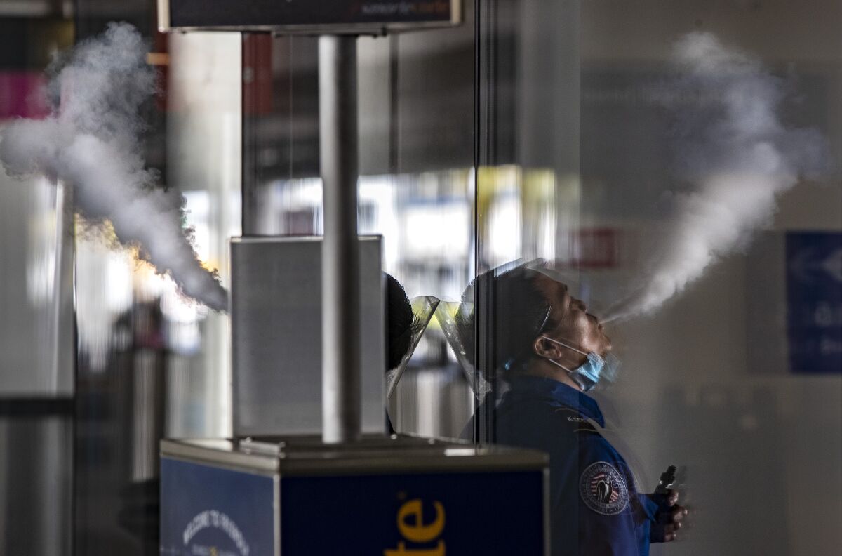 A person vapes.