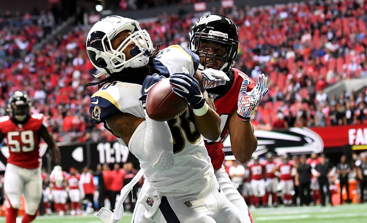 Rams running back Todd Gurley catches a touchdown pass in front of Falcons linebacker Vic Beasley Jr.