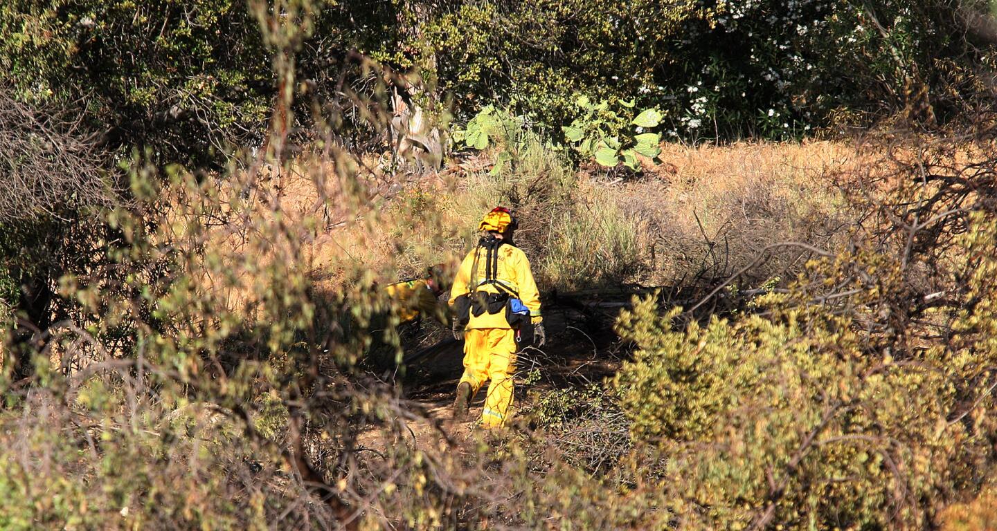 Photo Gallery: Brush fire mop up on Figueroa Street and Linda Vista Road