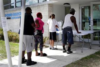 FLORIDA: April 8, 2020, restaurant worker Glen Pile, left, waits in line to get an unemployment form at a Miami-Dade County library during the new coronavirus pandemic in Miami. Pressure has mounted on Florida Gov. Ron DeSantis to make jobless benefits retroactive as the state's newly unemployed continued to be mired in an unemployment system riddled with glitches and uncertainty.