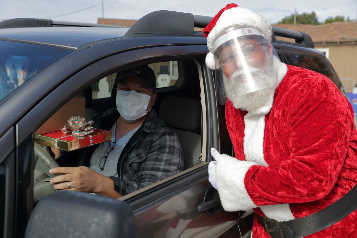 Santa greets a client with AniMeals gifts