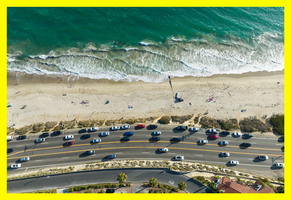 Ocean, beach and road with cars