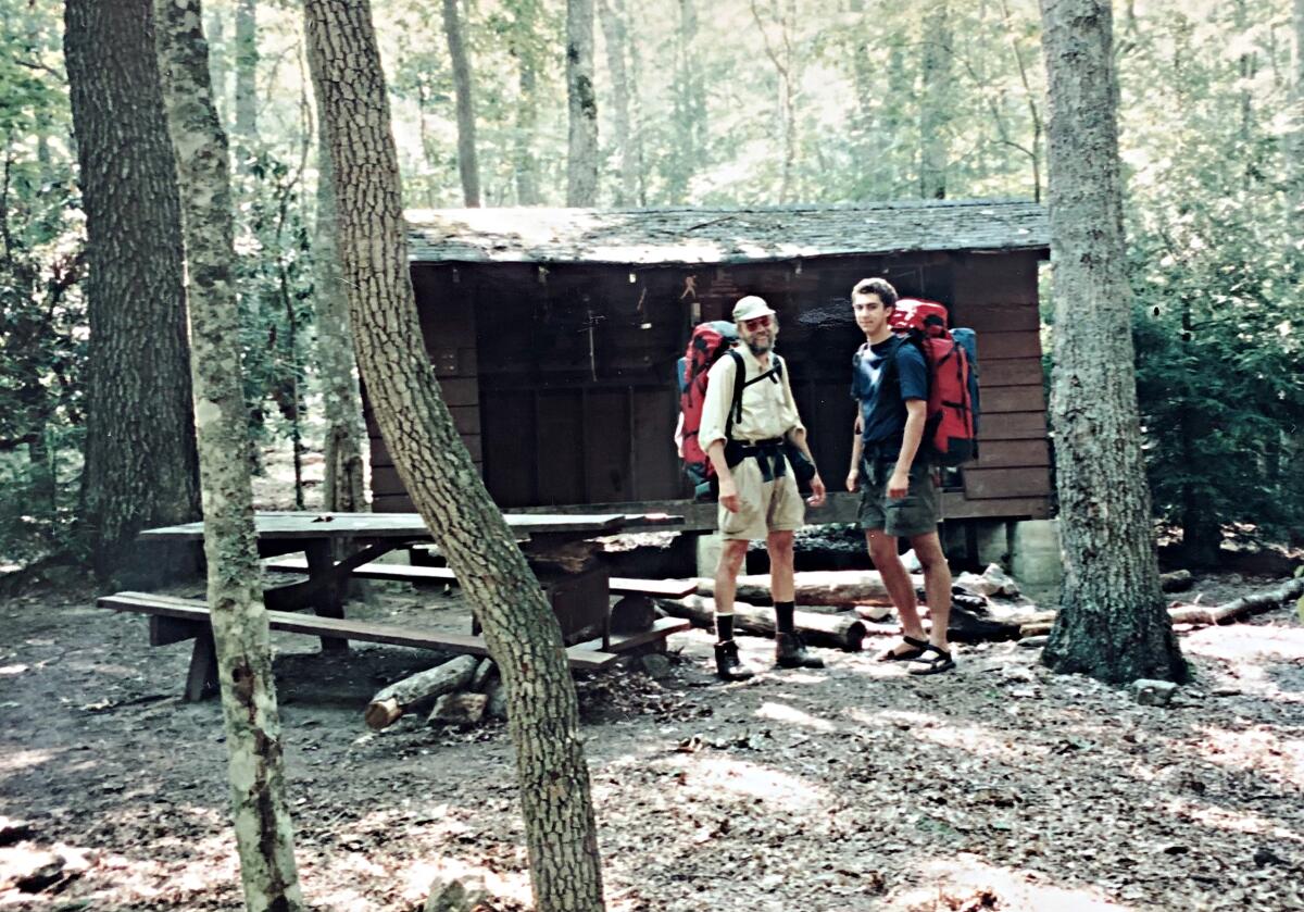 Two men at a campsite