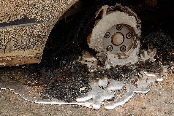 A car tire is completely melted by fire in Acton's Aliso Canyon.