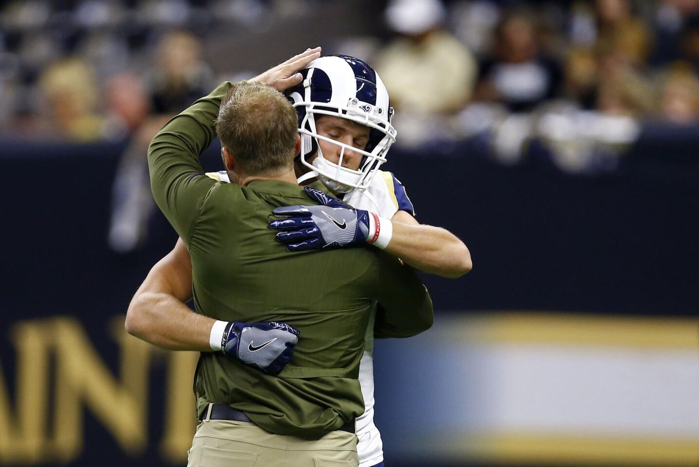 Los Angeles Rams head coach Sean McVay, left, hugs wide receiver Cooper Kupp before an NFL football game against the New Orleans Saints in New Orleans, Sunday, Nov. 4, 2018.