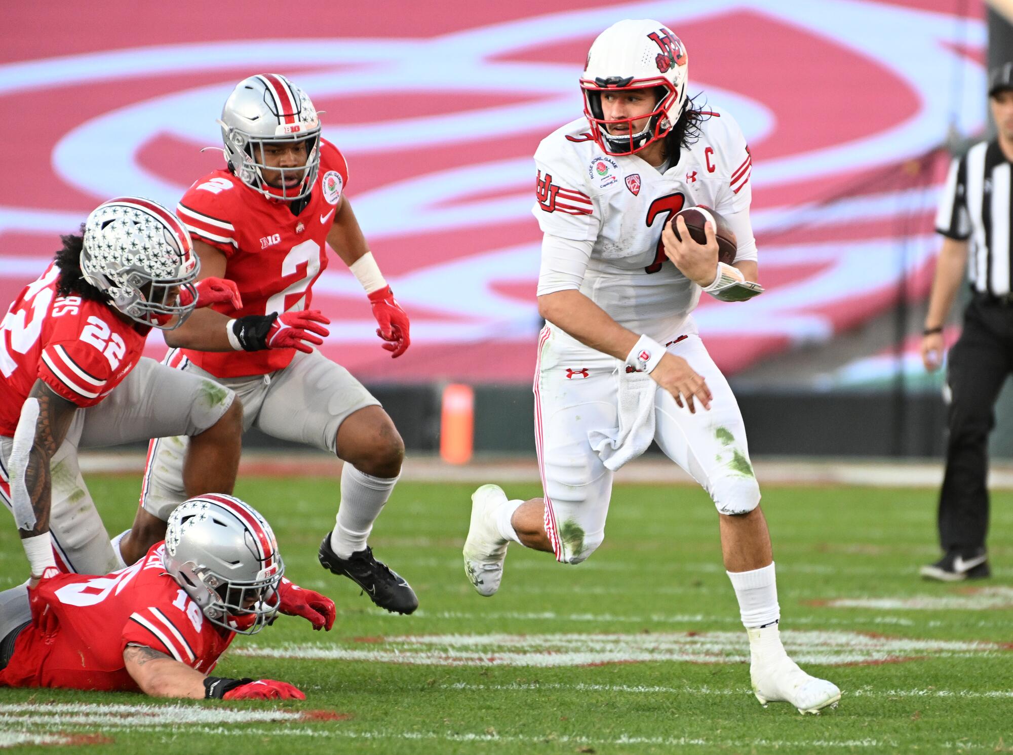 Utah quarterback Cameron Rising sprints past the Ohio State defense to score a touchdown.