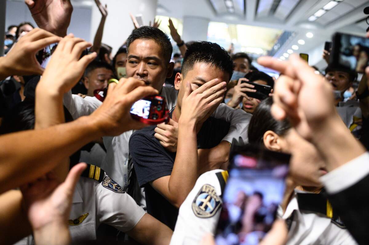 Protesters blocked passengers at departure halls of Hong Kong airport