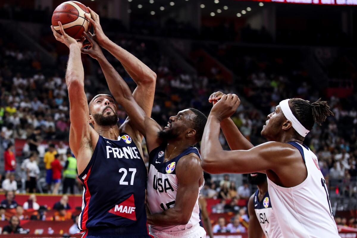 Evan Fournier of France drives as Kemba Walker of Team USA defends during a FIBA World Cup game Sept. 11 in Dongguan, China. 