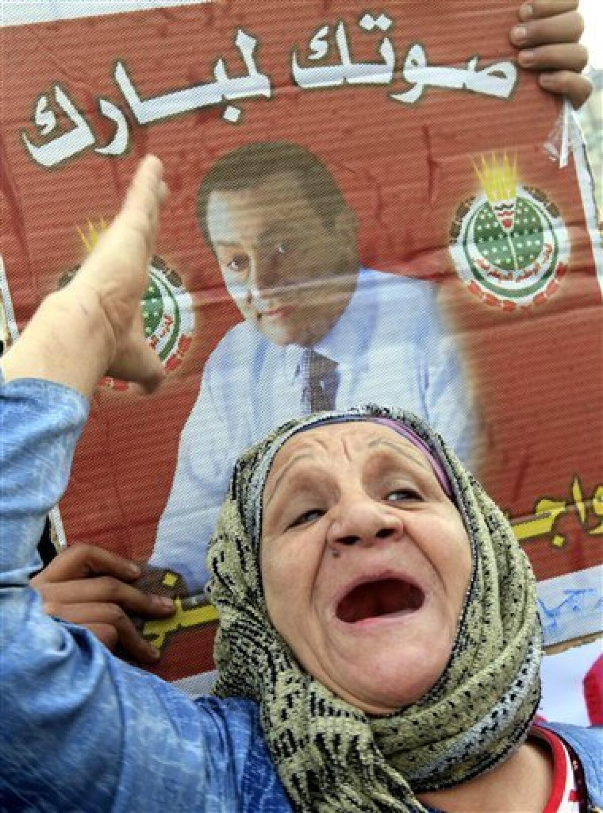 An elderly Egyptian pro-Mubarak supporter shouts supporting slogans during a march in Cairo, Egypt, Tuesday, Feb. 1, 2011. Egyptian authorities battled to save President Hosni Mubarak's regime with a series of concessions and promises to protesters, but realities on the streets of Cairo may be outrunning his capacity for change. Arabic poster dating from 2005 Presidential elections reads " your vote to Mubarak" (AP Photo/Amr Nabil)