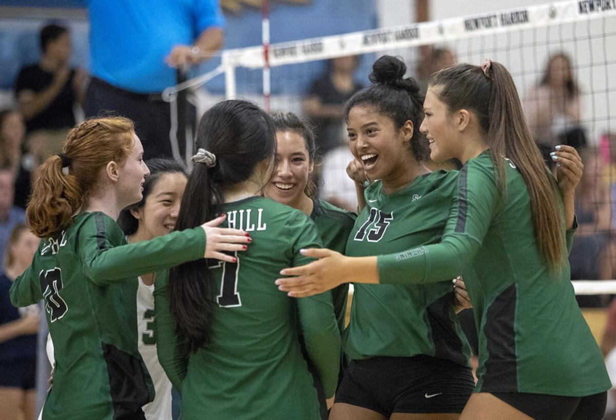 Sage Hill celebrates after winning a point in a nonleague match at Newport Harbor on Tuesday.