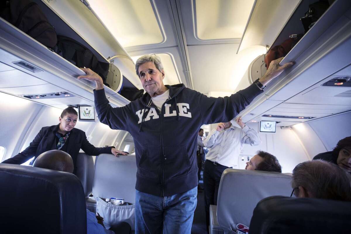 Secretary of State John F. Kerry speaks to the media aboard his plane Sunday before heading back to the United States after a Mideast trip.
