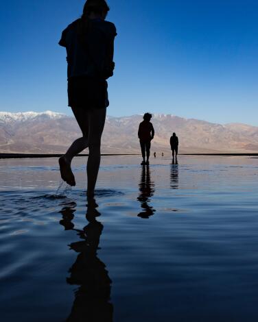 Visitors walk in Death Valley National Park.