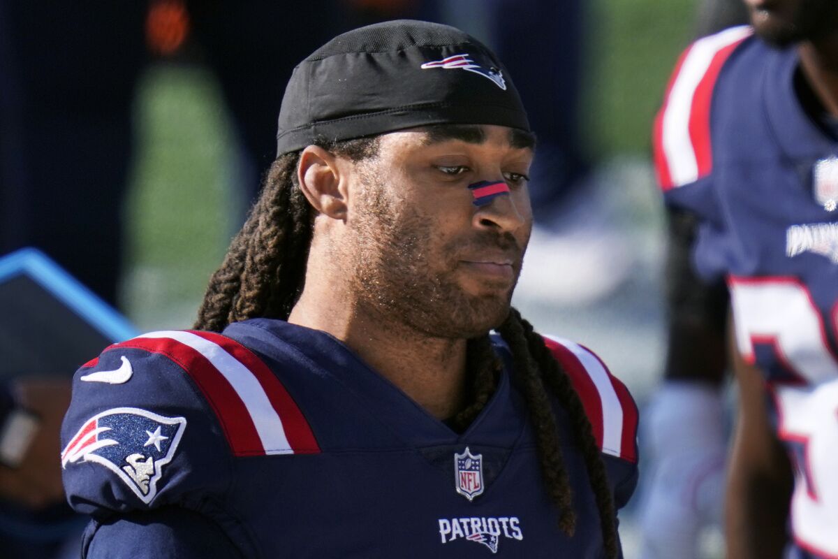 FILE - In this Oct. 18, 2020, file photo, New England Patriots cornerback Stephon Gilmore stands along the sideline during the second half of the team's NFL football game against the Denver Broncos in Foxborough, Mass. The Patriots are releasing 2019 NFL Defensive Player of the Year Stephon Gilmore after the two sides couldn’t come to terms on a new contract. (AP Photo/Charles Krupa, File)