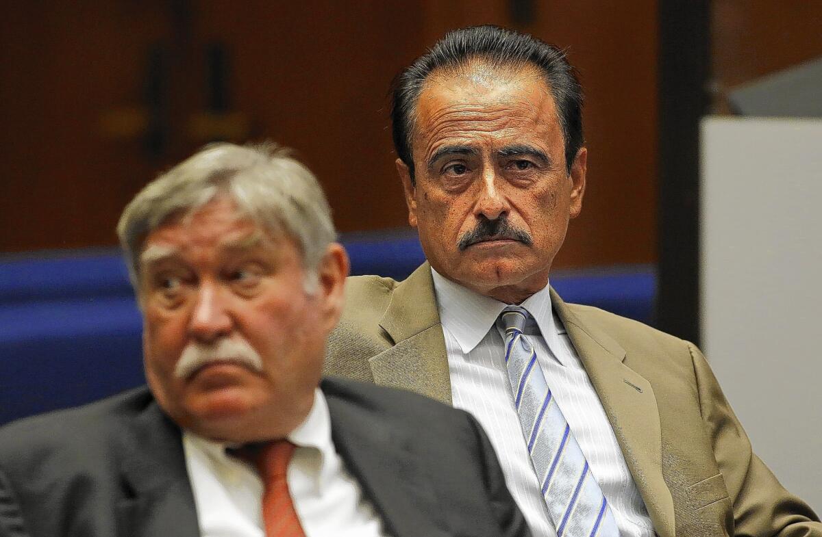 Richard Alarcon, right, and his attorney, Richard Lasting, listen to testimony during the former councilman's perjury and voter fraud trial in downtown L.A.