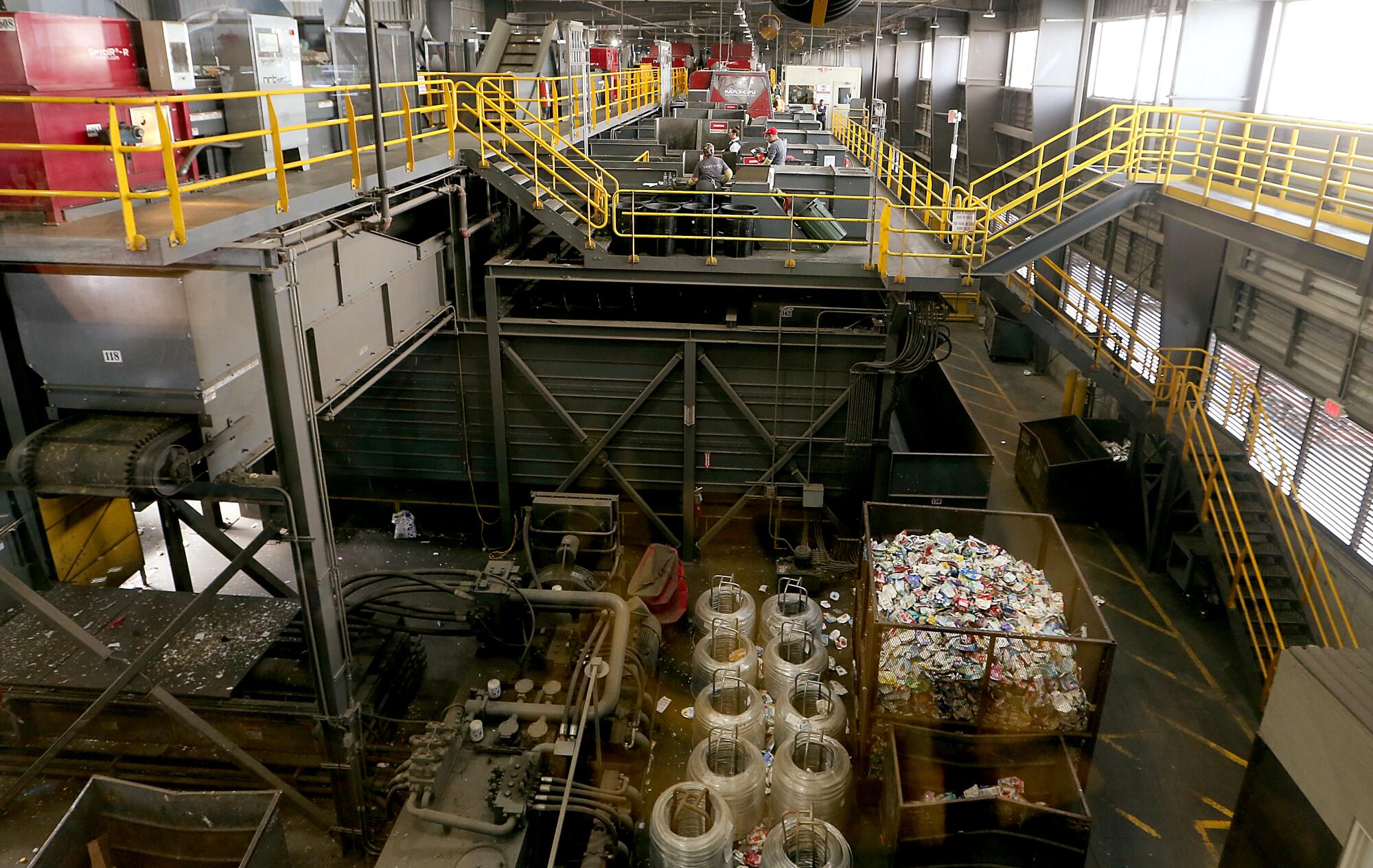 Large waste recycling machinery is housed inside the Athens material recovery facility in Sun Valley.
