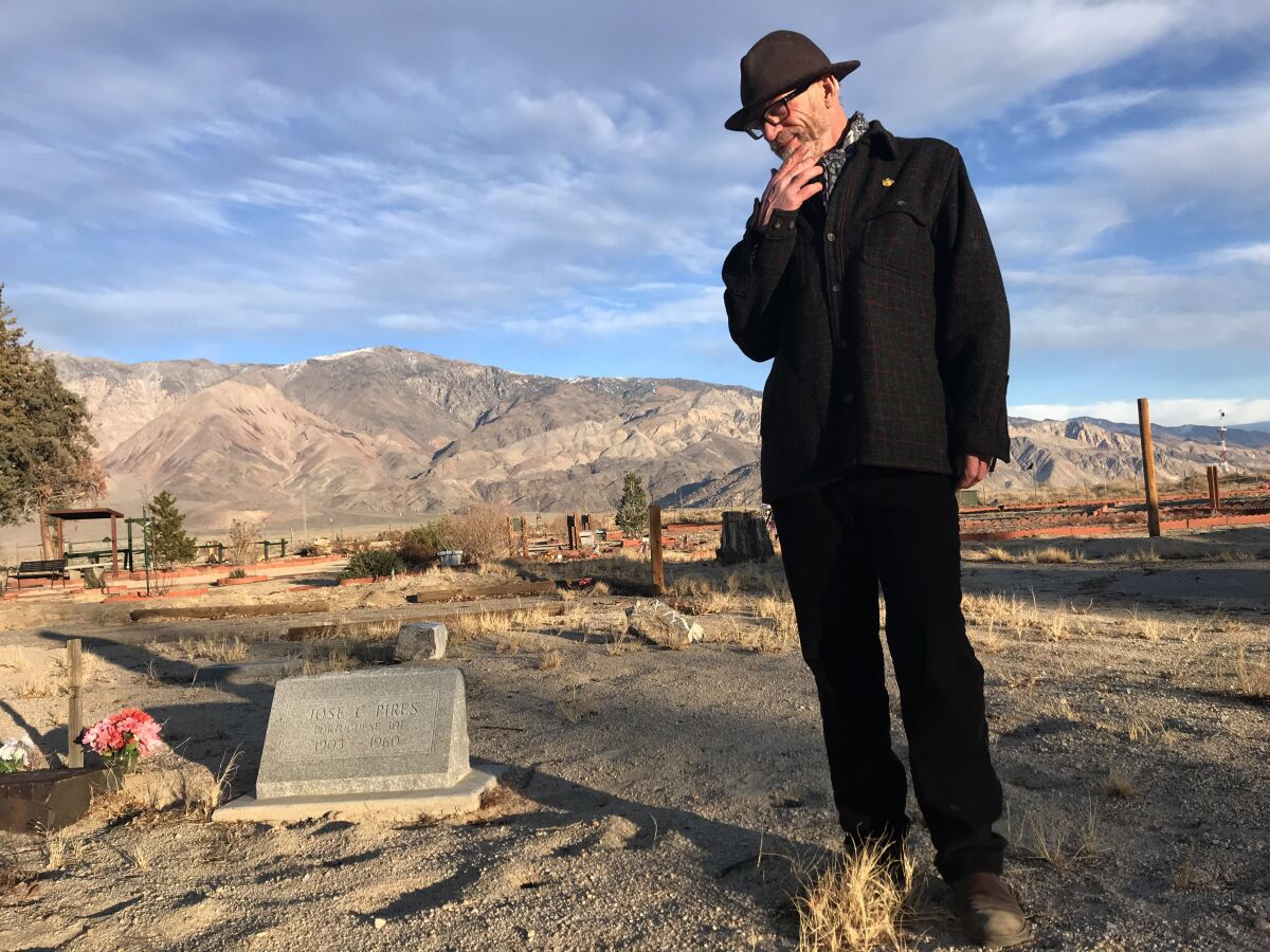 Allen Berrey visits the grave site of Jose C. Pires at Mt. Whitney Cemetery in Lone Pine, Calif.