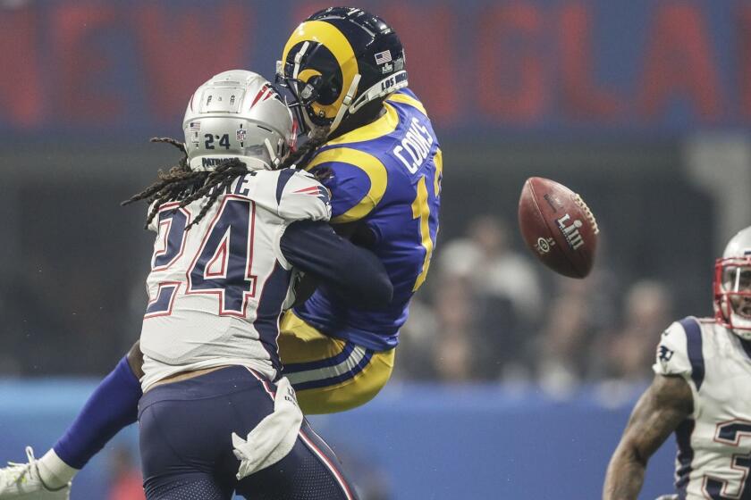 ATLANTA, GEORGIA, FEBRUARY 3, 2019 - Patriots defensive back Stephon Gilmore prevents Rams receiver Brandin Cooks from making a catch on a third quarter pass in Super Bowl LIII at Mercedes-Benz Stadium. (Robert Gauthier/Los Angeles Times)