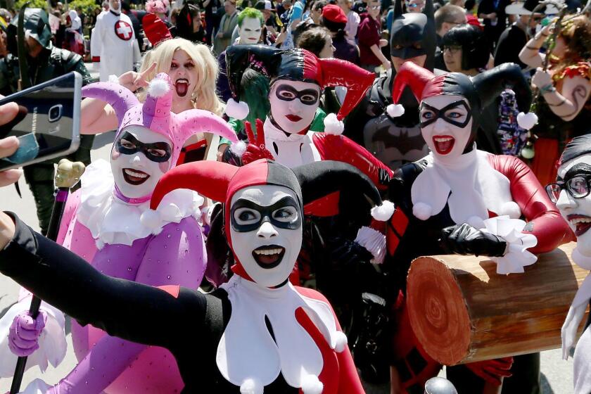 ANAHEIM, CALIF. - APRIL 1, 2017. A group of harlequins pose for selfies during Cosplay Wondercon 2017 at the Anaheim Convention Center on Saturday, April 1, 2017. Wondercon is one of the largest comic conventions on the west coast, with more than 900 exhibitors and presentations from the entertainment industry, including Warner Bros., DC Comics, Marvel Comics, Dreamworks Studios, NBC and Fox Television. (Luis Sinco/Los Angeles Times)