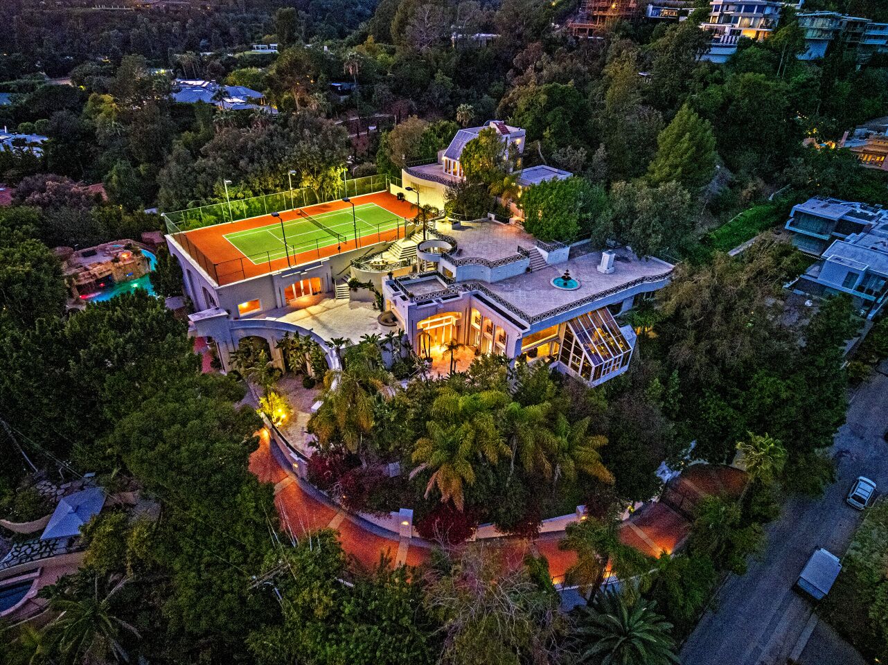 Built by contractor and noted playboy Hal B. Hayes in the 1950s, the 18,000-square-foot mansion was built to withstand a nuclear blast and features a sealed underground cave accessed by an underwater tunnel. In the 2000s, the home was owned by former NBA player Carlos Boozer, who leased the property to the late pop star Prince. It's now for sale at about $30 million. Boozer later sued Prince for damages after the pop star renovated the home and added a heart-shaped bed in the master bedroom as well as a hair salon in a spare bedroom. Italian carpets were replaced with shades of purple and black. (The Oppenheim Group)