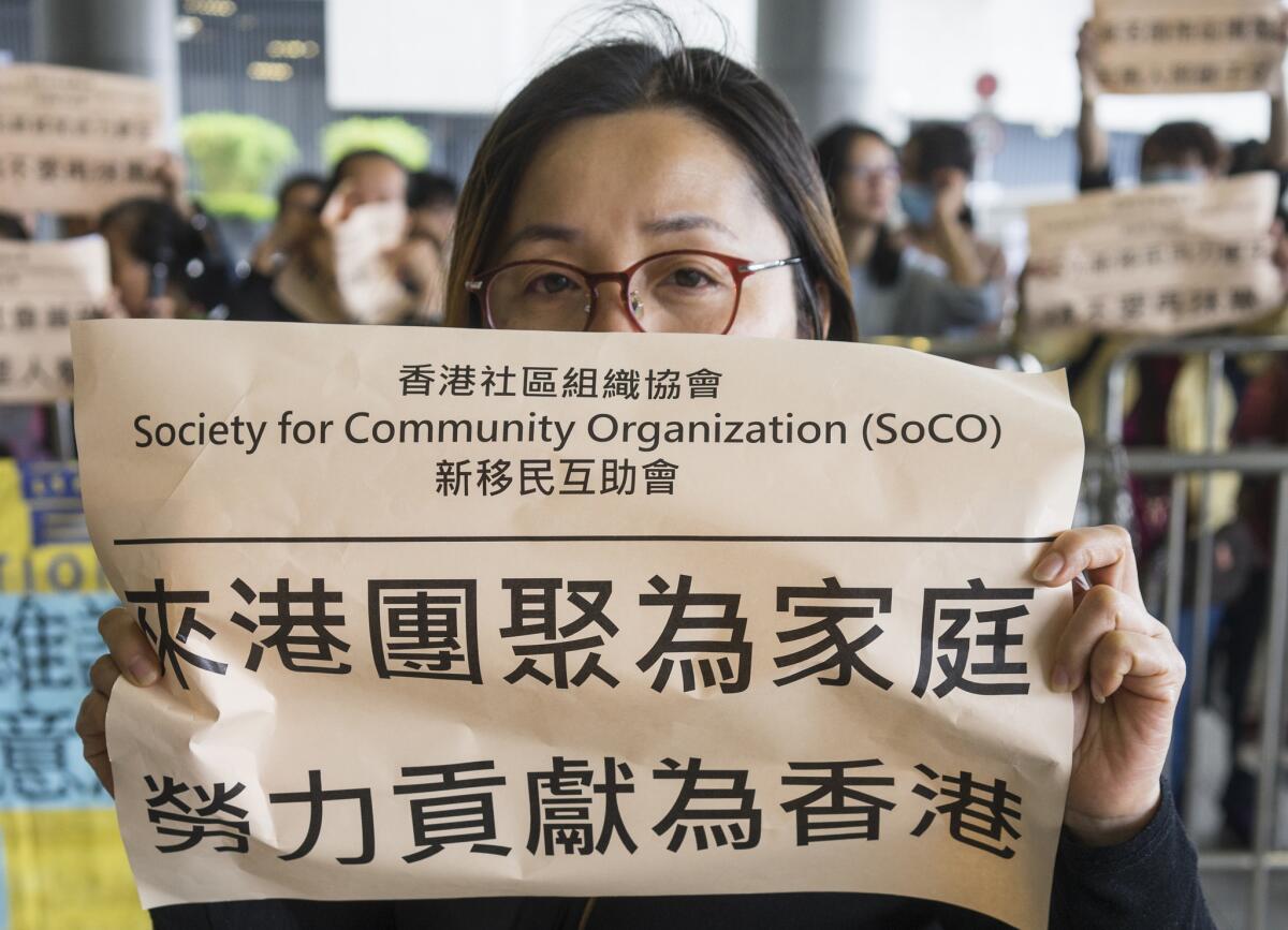 Mai Han joins other mainland mothers in a protest outside a government building in Hong Kong.
