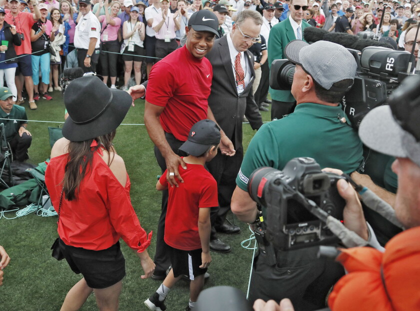 Thinking of his dad, Woods notches a Masters victory that ...