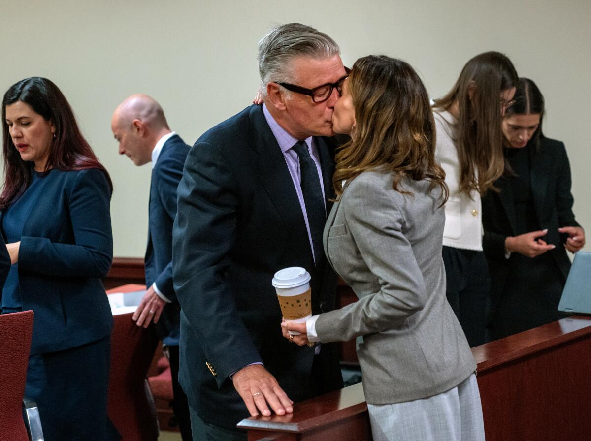 Actor and producer Alec Baldwin kisses his wife, Hilaria, in First District Court.