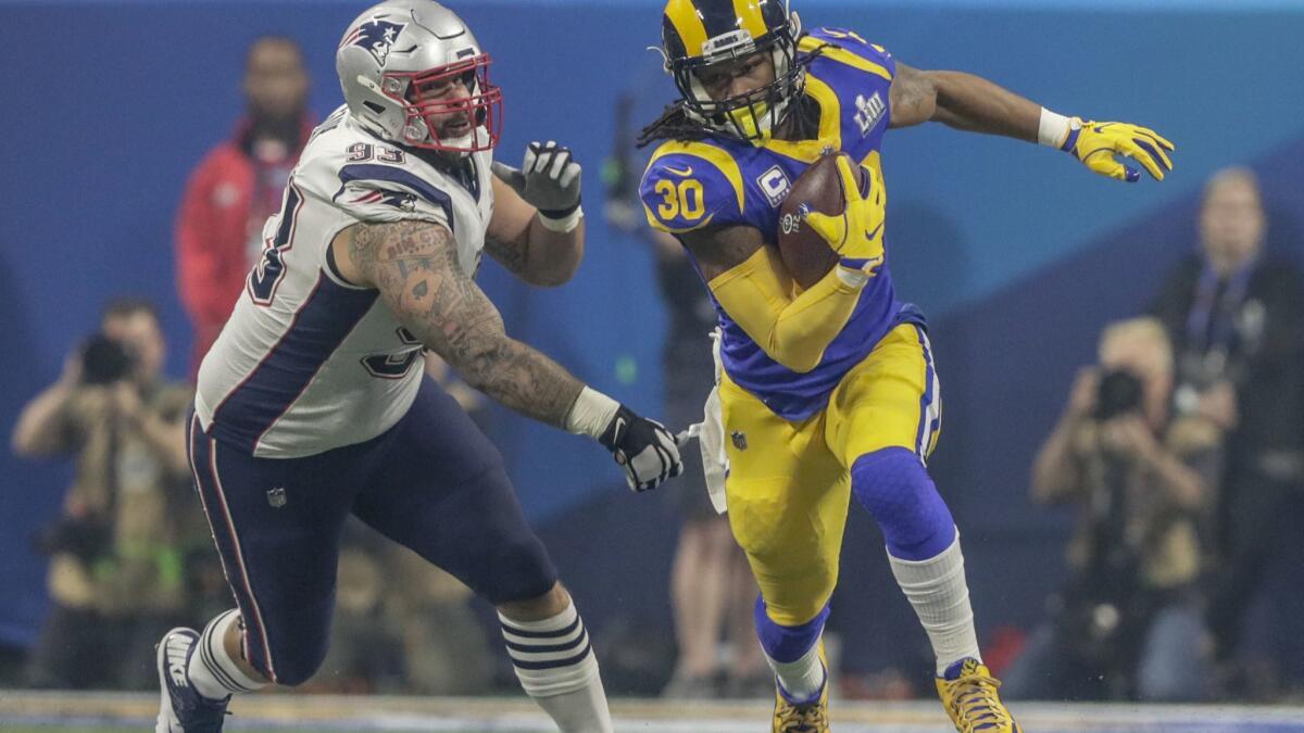 Rams running back Todd Gurley tries to get past Patriots defensive lineman Lawrence Guy in Super Bowl LIII in Atlanta.