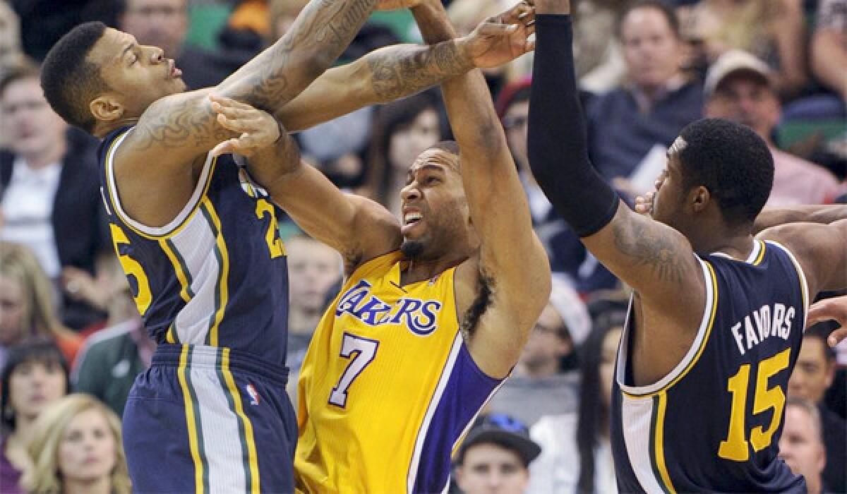 Lakers guard Xavier Henry is expected to be out another week because of a sprained knee, the team announced Tuesday.