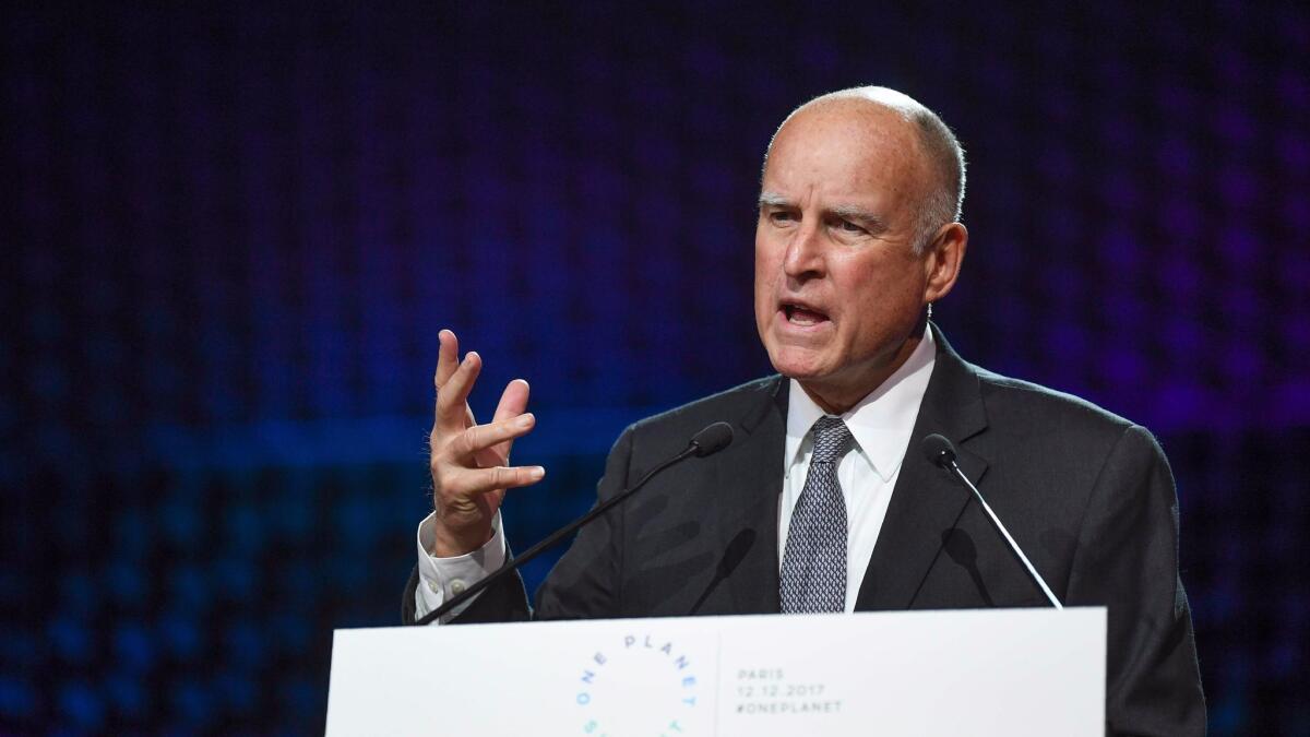 Gov. Jerry Brown speaks about climate change at a summit near Paris on Dec. 12.