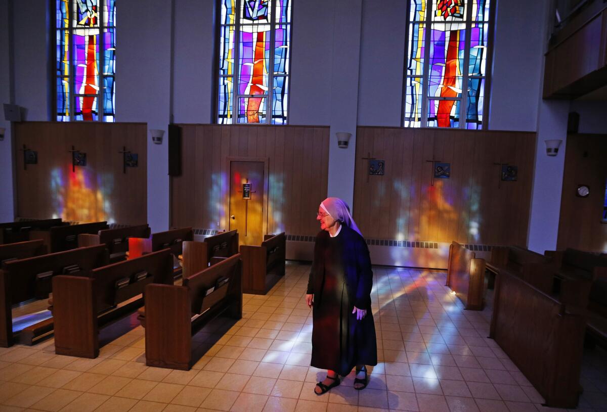 Mother Patricia Mary walks in the chapel at the Mullen Home for the Aged, run by the Little Sisters of the Poor, in Denver on Jan. 2. The U.S. Supreme court ruled last week that the Obama administration could not force some religious-affiliated groups to provide contraceptive coverage while their challenge was being heard in a lower court.
