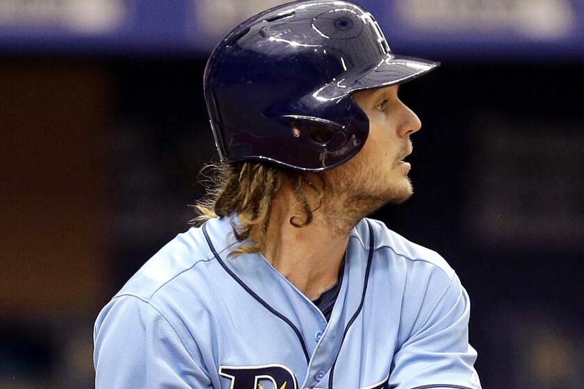 John Jaso watches a two-run double he hit against the Mets during a game with the Tampa Bay Rays on Aug. 9.