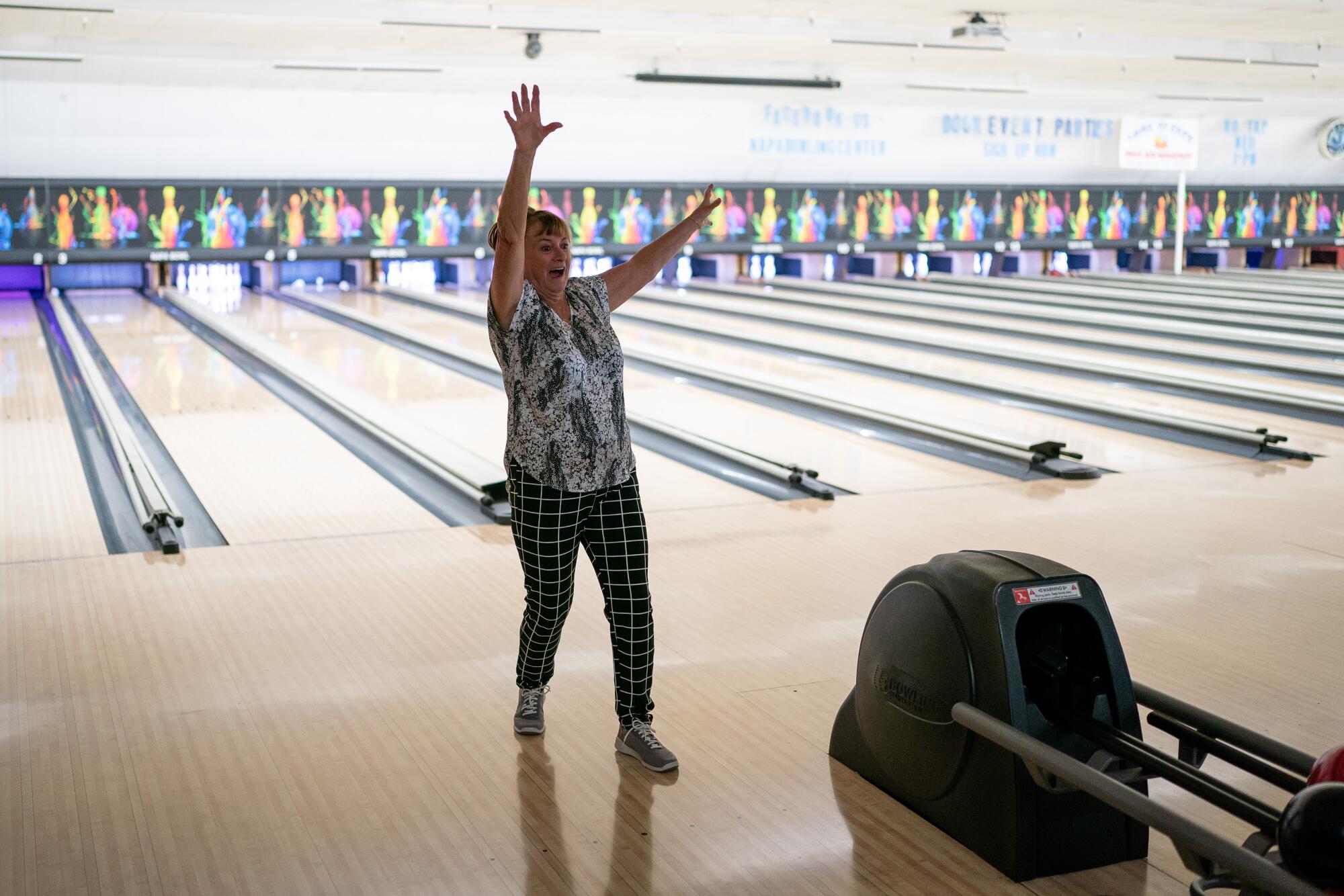 Bowler Roxanne Quirk with her hands in the air.