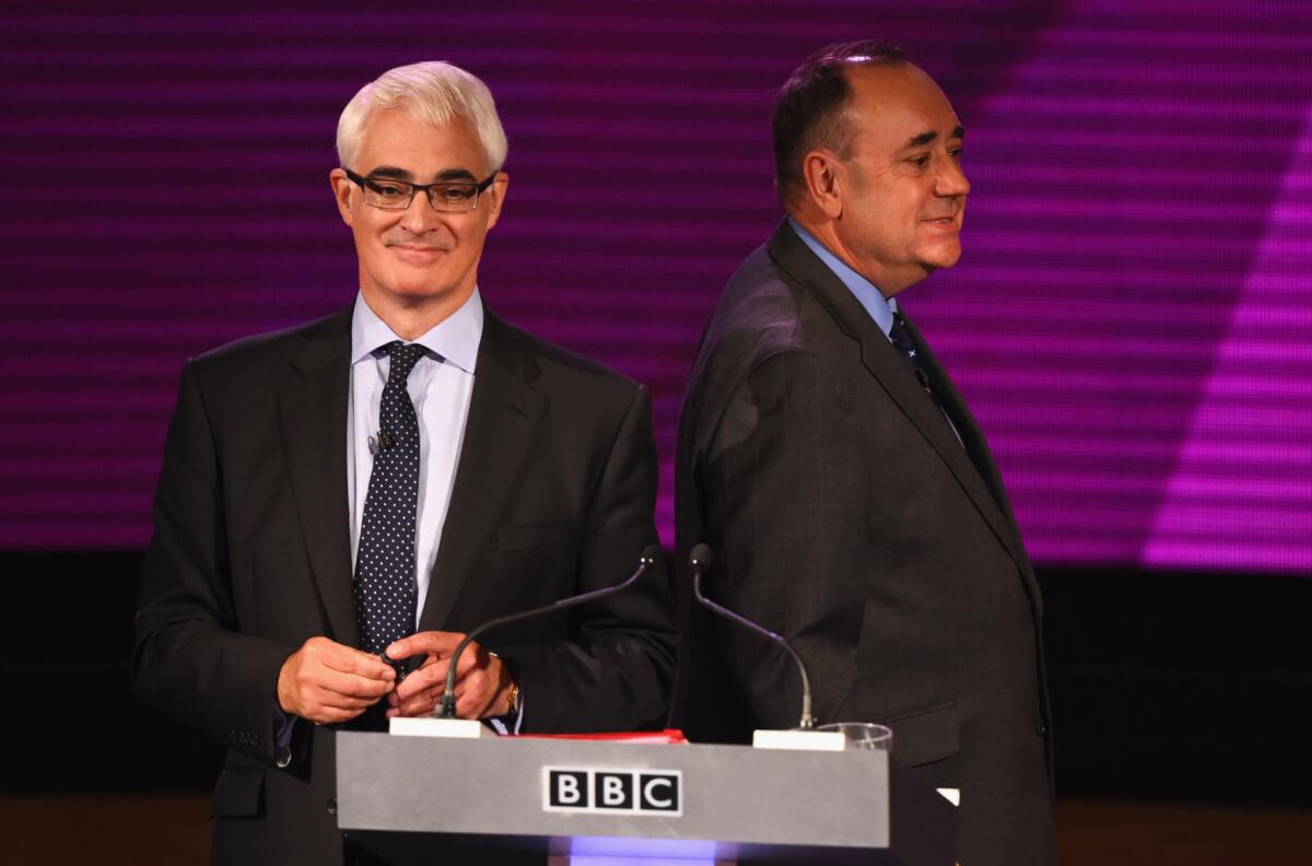 Alistair Darling, left, a leading opponent of Scottish independence, and Alex Salmond, first minister of Scotland, take part in a live television debate in Glasgow on Monday.