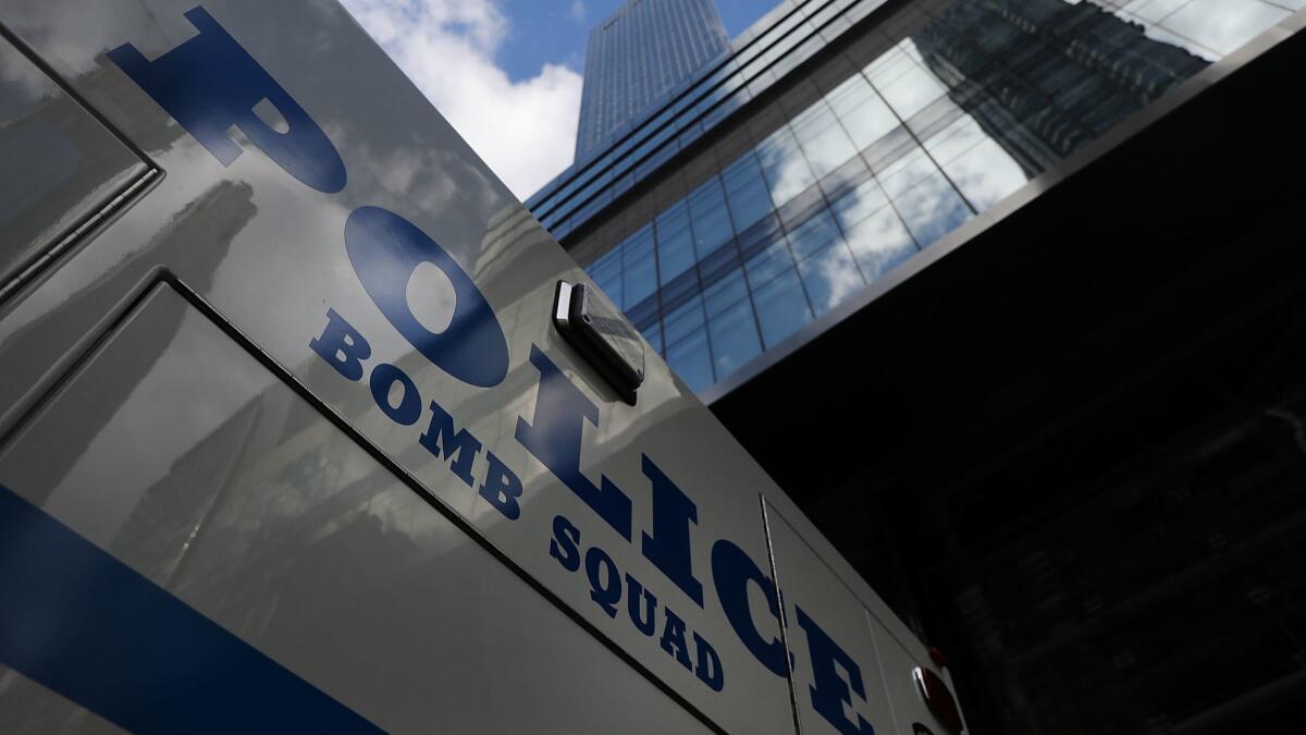 A police vehicle sits outside of the Time Warner Center after an explosive device was found Oct. 24 in New York City.