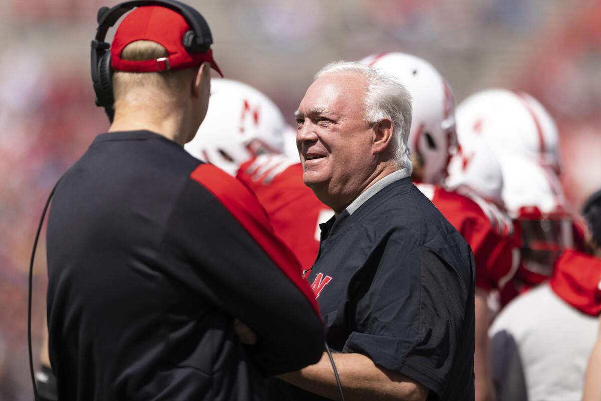 Nebraska offensive coordinator Mark Whipple, right, chats with head coach Scott Frost during a timeout in the first half of Nebraska's NCAA college football annual red-white spring game at Memorial Stadium in Lincoln, Neb., Saturday, April 9, 2022. (AP Photo/Rebecca S. Gratz)