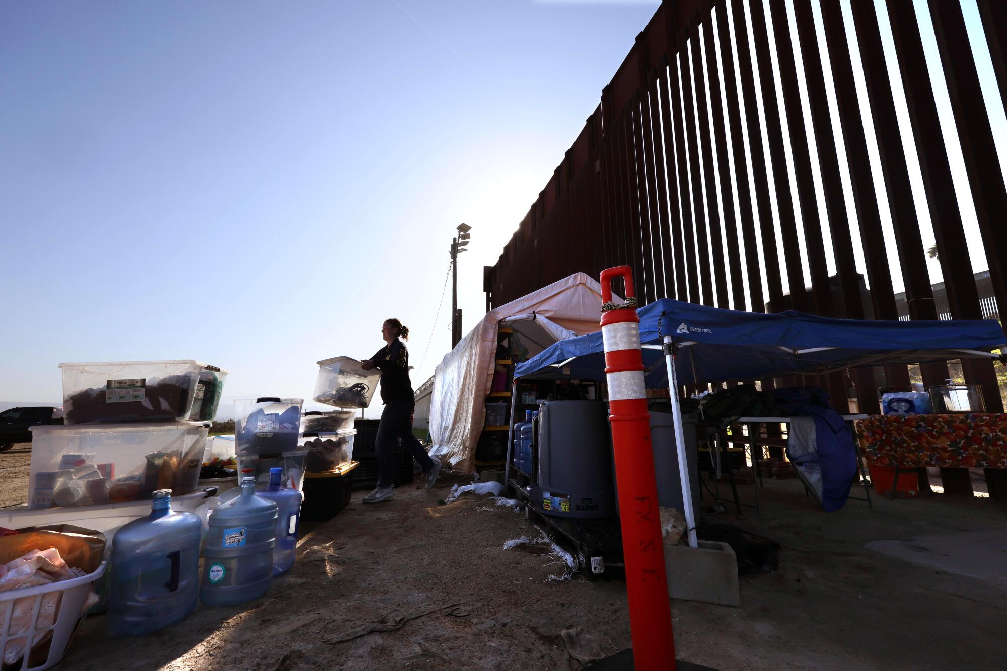 American Friends Service Commission (AFSC) volunteer Emma Starkey packs his bags in a district called Whiskey 8 in San Ysidro.