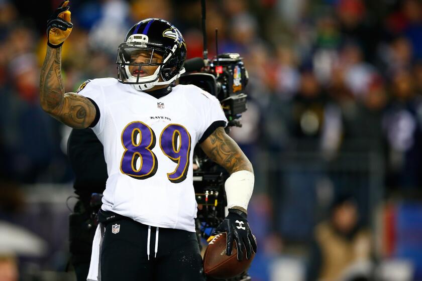 Ravens receiver Steve Smith celebrates after scoring a touchdown in the first quarter against the New England Patriots during the 2014 AFC divisional playoffs at Gillette Stadium.