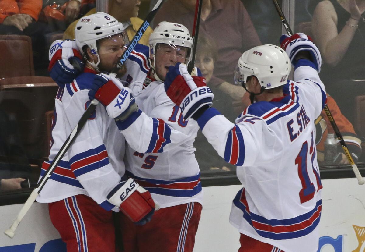 New York Rangers defenseman Kevin Klein, left, celebrates with teammates J.T. Miller, center, and Eric Staal after scoring a second goal against the Ducks on March 16.