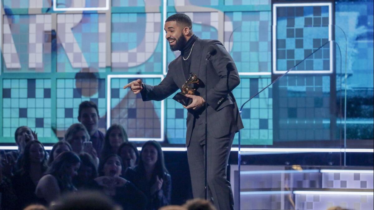 Canadian rapper Drake accepts the award for Best Rap Song for 'God's Plan'at the 61st Grammy Awards.