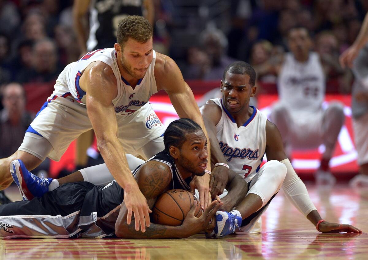 San Antonio's Kawhi Leonard steals the ball away from Blake Griffin during the Spurs' 89-85 win over the Clippers on Nov. 10 at Staples Center.