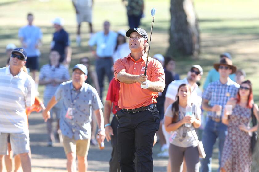 Scott McCarron watches his approach shot to the 10th hole during the second round of the Toshiba Classic on at the Newport Beach Country Club on Saturday.