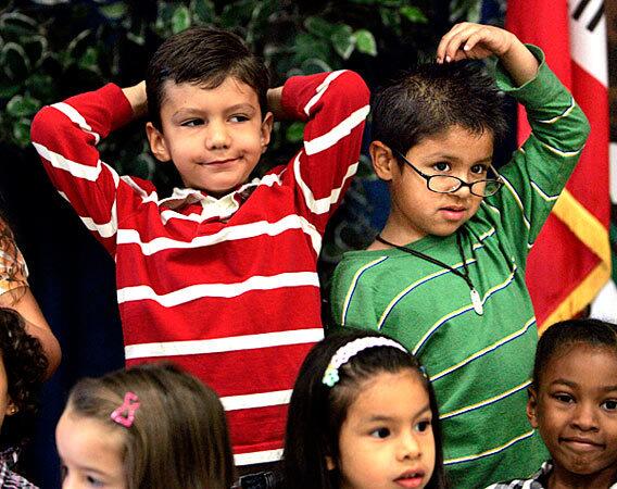 Alex Sprague, left, and Steven Cervantes, both second-graders at Capistrano Avenue Elementary in West Hills, can't seem to stand still for a group shot during the school's annual picture day.
