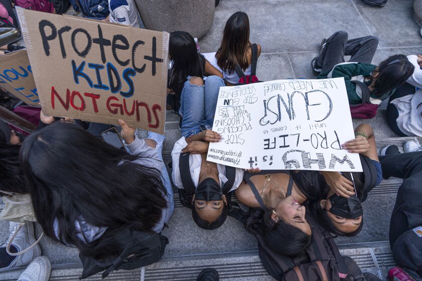 Dozens of high school students at Miguel Contreras Learning Complex walked out to show their support for students and families in Uvalde, Texas, by rallying outside Los Angeles City Hall on Tuesday, May 31, 2022. (AP Photo/Damian Dovarganes)